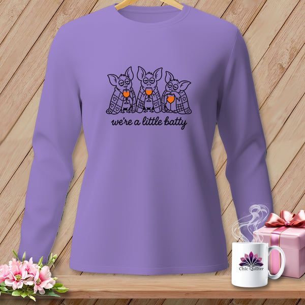 Purple long-sleeved shirt with bats drinking and "we're a little batty" text.