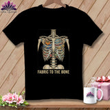 Black t-shirt with skeleton ribcage filled with sewing notions and fabric, text 