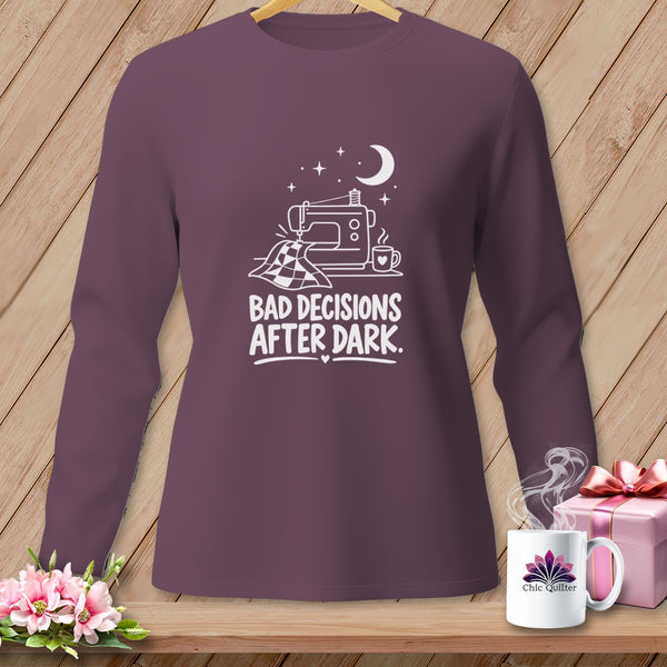 Purple long-sleeve shirt with white graphic of sewing machine, quilt, and text "BAD DECISIONS AFTER DARK."