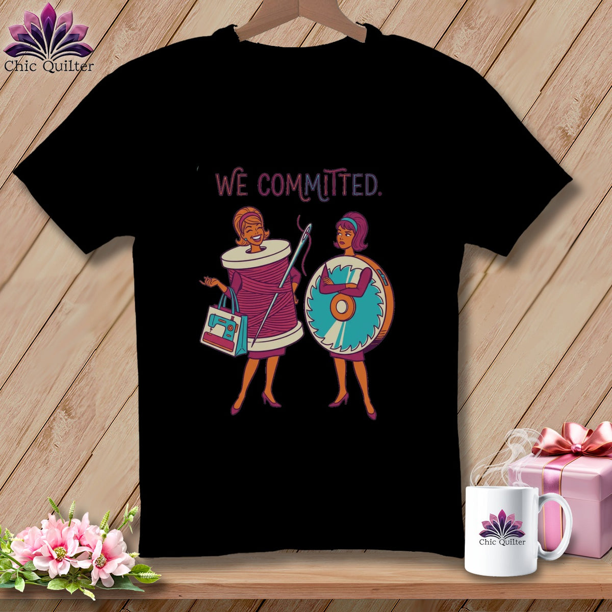 Black t-shirt with "We Committed." and cartoon quilters.