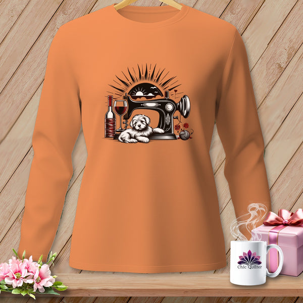 Orange long-sleeve shirt with sewing machine, dog, wine, and yarn graphic.