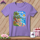 A light purple t-shirt featuring a vibrant graphic of a tropical beach scene with a colorful quilt draped on the sand.