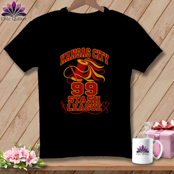 A black short-sleeved t-shirt features Kansas City Stash League and number 99 graphics with sewing-themed elements.