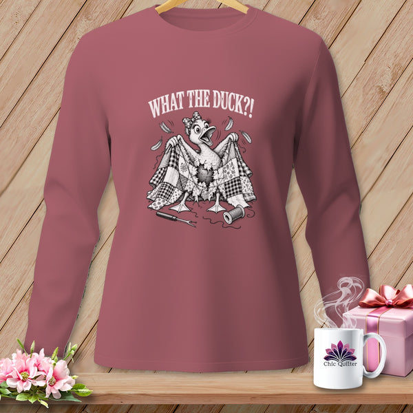 Dusty rose long-sleeve shirt featuring a black and white graphic of a duck holding a patchwork quilt and the text WHAT THE DUCK?!