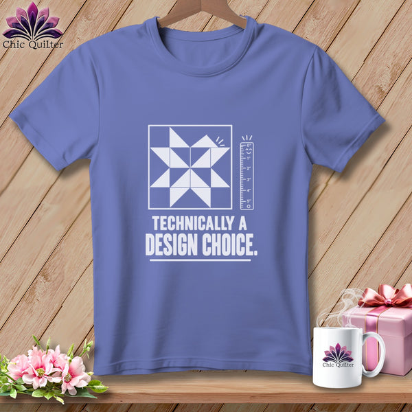 Periwinkle t-shirt with white quilt block design and "Technically a Design Choice." text.