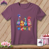 Purple crewneck t-shirt featuring a colorful cartoon illustration of four birds sitting on a knitting needle.