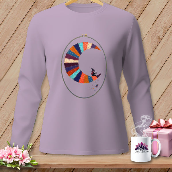Purple long-sleeve shirt with a crescent moon embroidery of a witch and sewing elements.