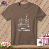 Brown t-shirt with white outline of a broken sewing machine and text 