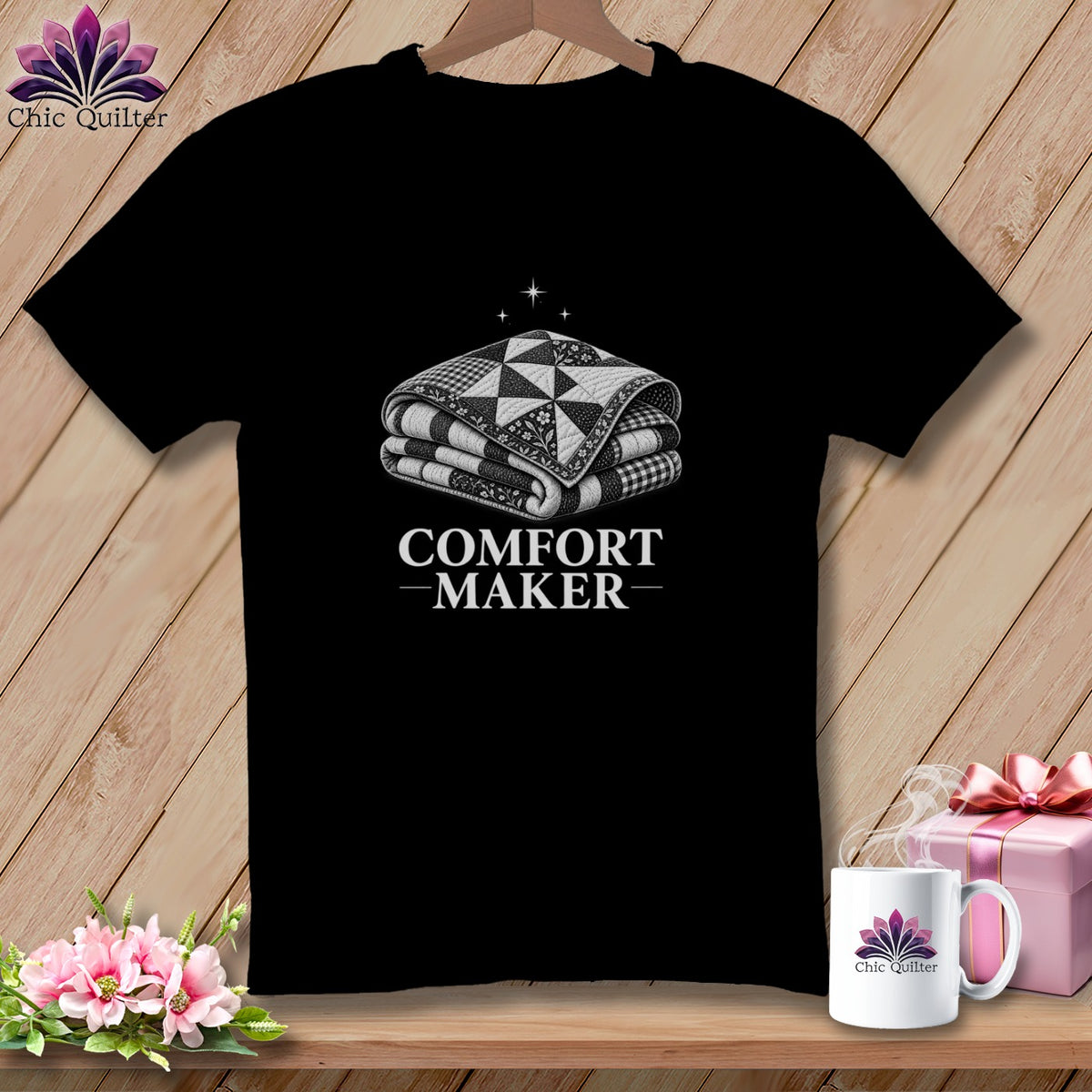 Black t-shirt with a folded quilt graphic and "COMFORT MAKER" text.