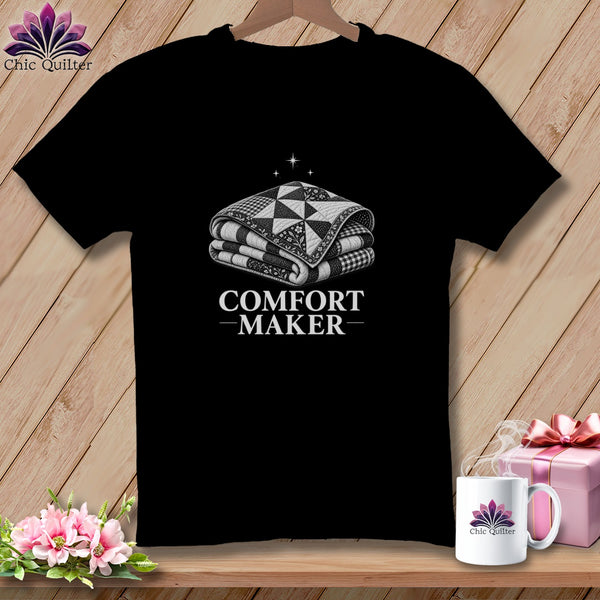 Black t-shirt with a folded quilt graphic and "COMFORT MAKER" text.