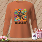 Orange long-sleeve shirt with a witch riding a ruler and the text 