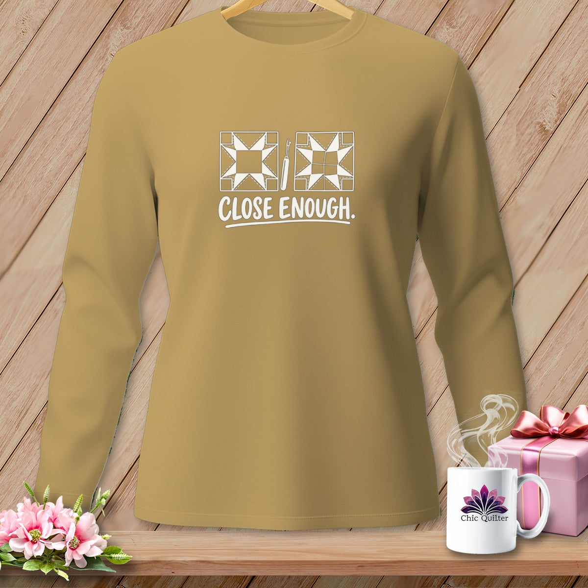 Tan long-sleeve shirt with "CLOSE ENOUGH" and quilting graphics.