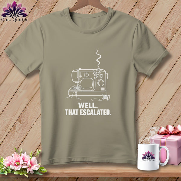 T-shirt with white line art of a sewing machine and text "WELL. THAT ESCALATED."