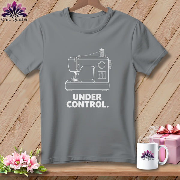 Grey t-shirt with white sewing machine graphic and "UNDER CONTROL." text.