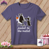 Purple t-shirt with a cartoon penguin sewing and holding a drink, text 