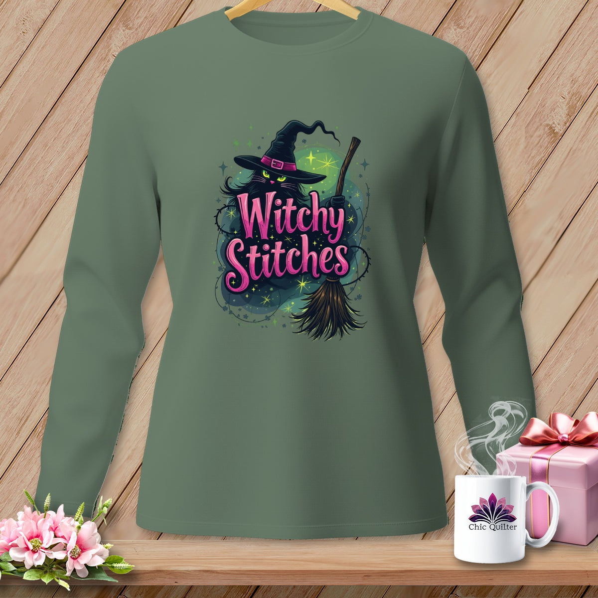 Green long-sleeve shirt with "Witchy Stitches" text and a witch hat.
