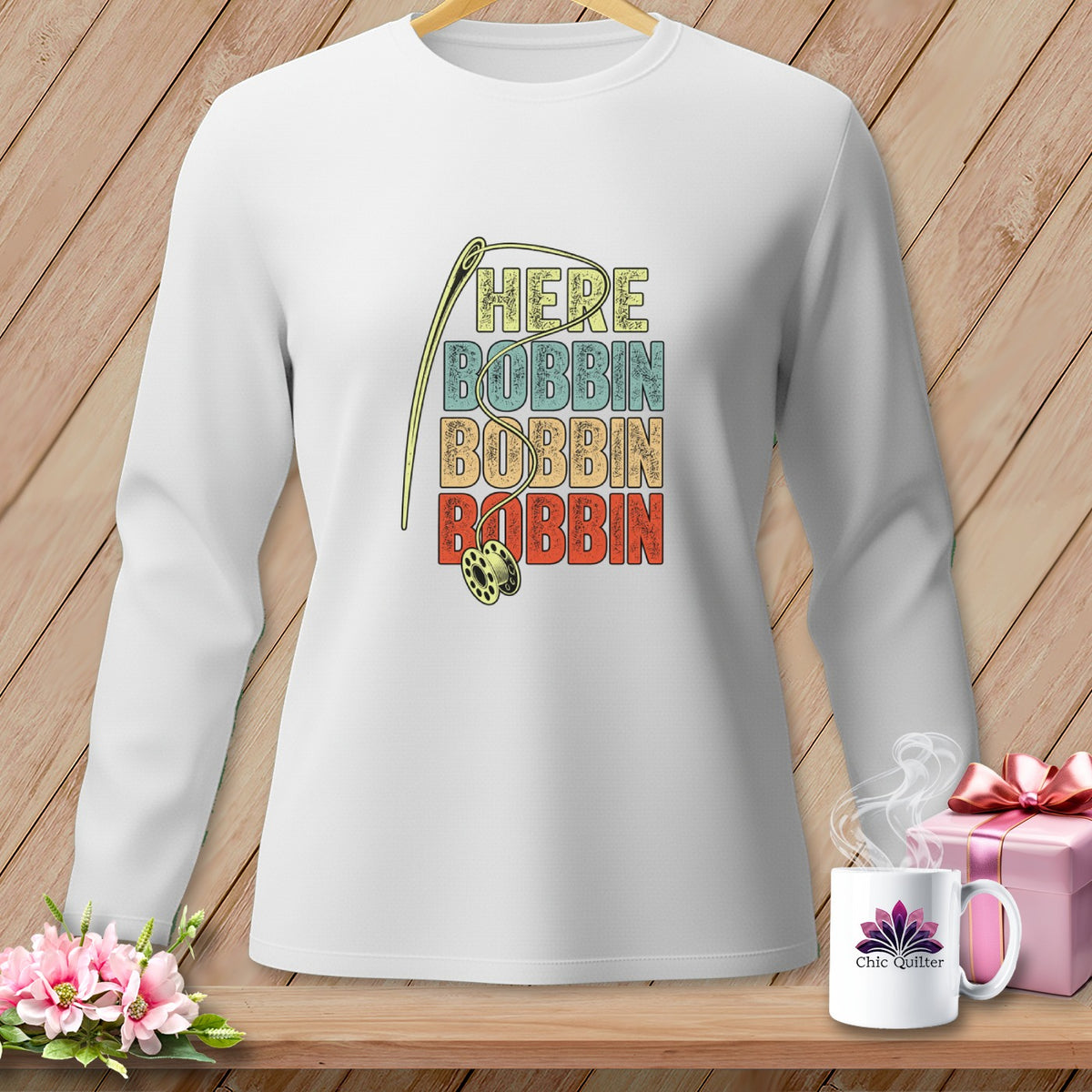 White long sleeve shirt with "HERE BOBBIN BOBBIN BOBBIN" and needle design.