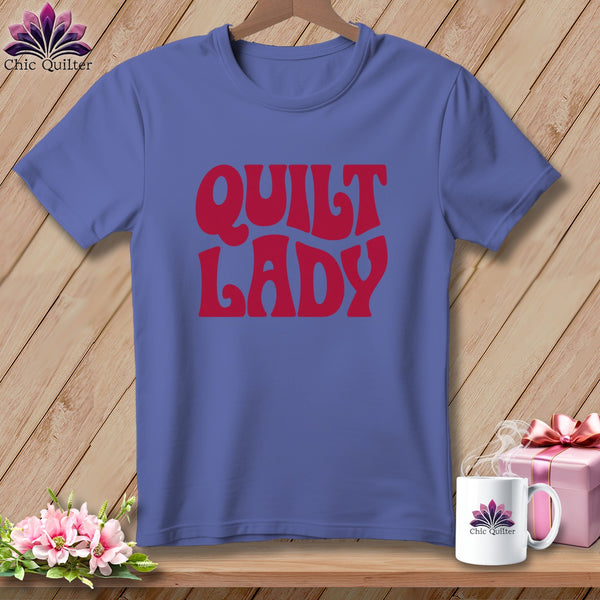 Purple t-shirt with red "QUILT LADY" text and Chic Quilter logo.