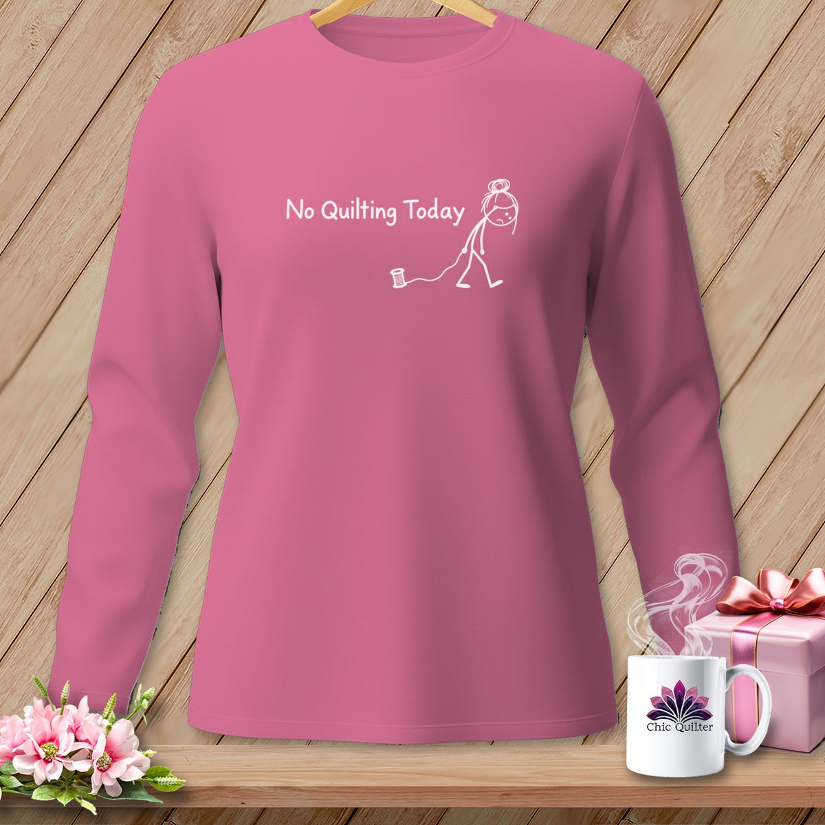Pink long-sleeve shirt with "No Quilting Today" and a stick figure graphic.