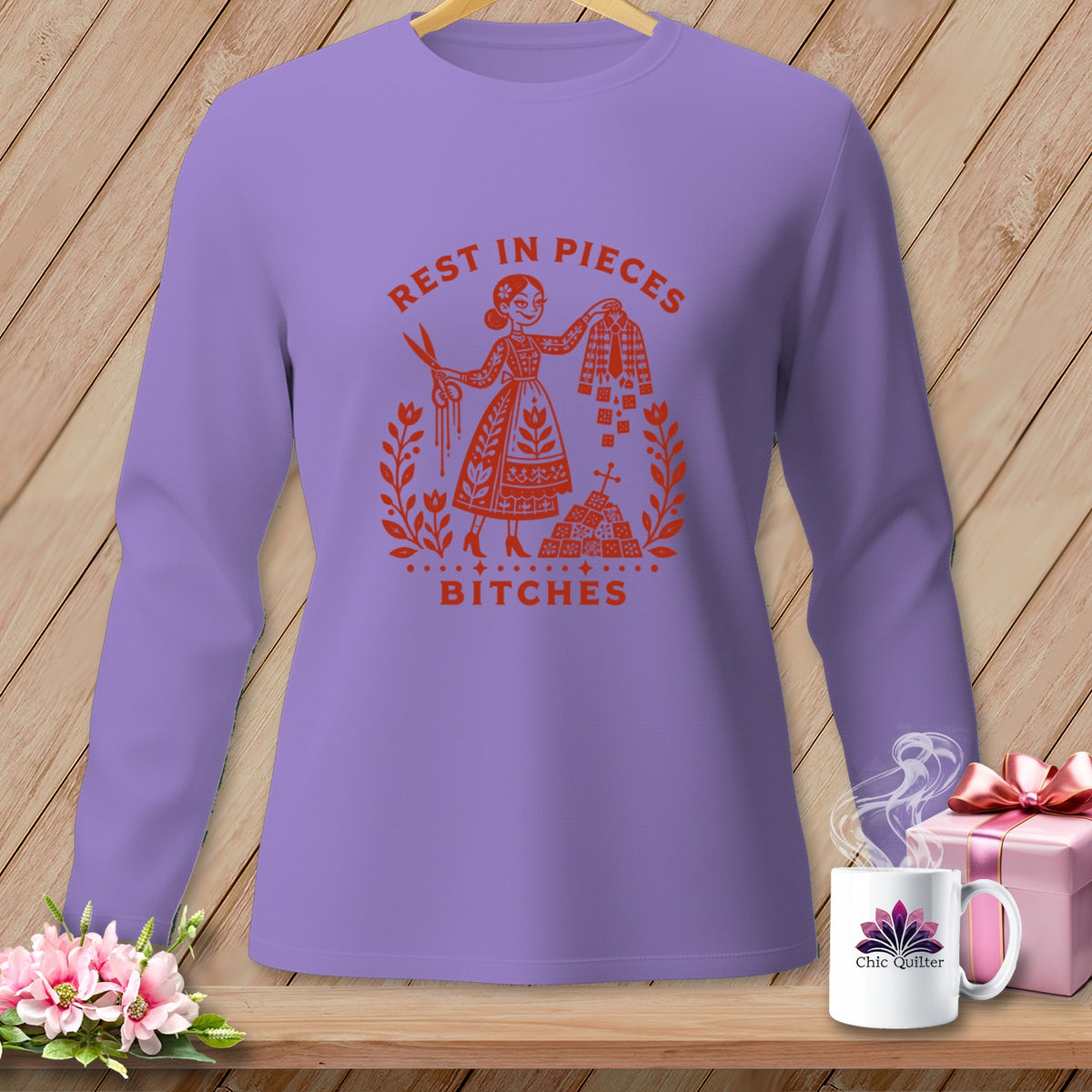Long-sleeve shirt with "Rest in Pieces Bitches" graphic and scissors.
