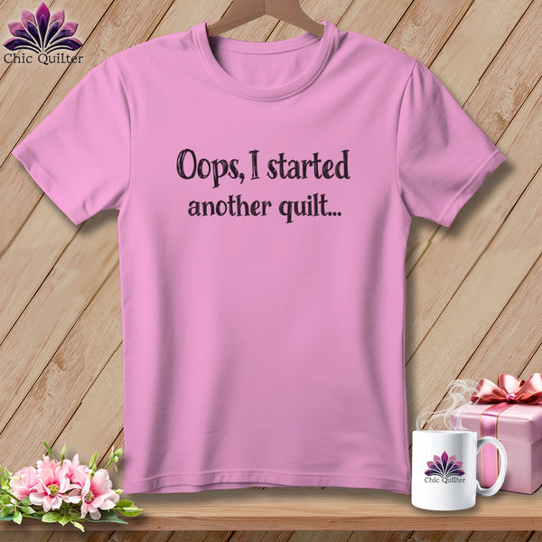 Pink t-shirt with "Oops, I started another quilt..." text.