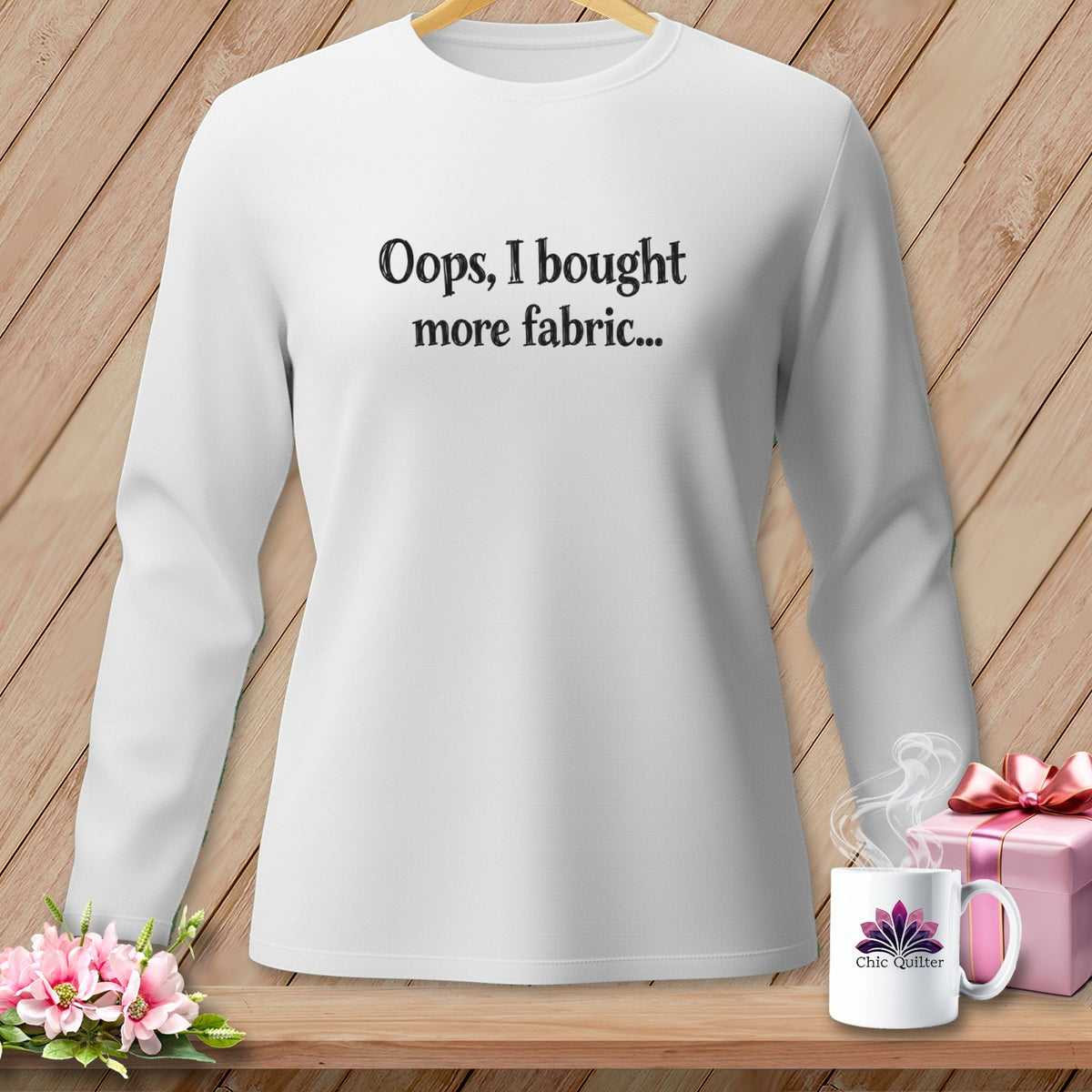 White long-sleeve shirt with "Oops, I bought more fabric..." text.