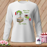 White sweatshirt with Grinch-like hands holding fabric, a glass of wine, and text 