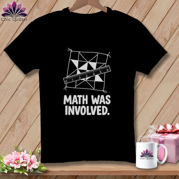 Black t-shirt with "Math Was Involved" and quilt design with ruler.