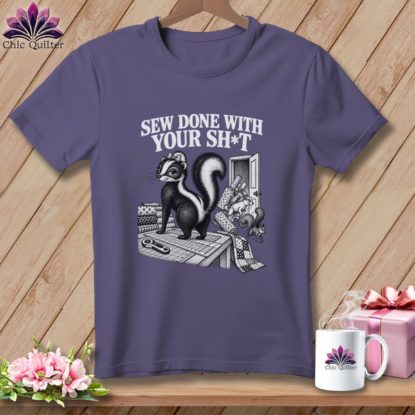 Skunk on cutting mat with fabric and text "Sew done with your sh*t".