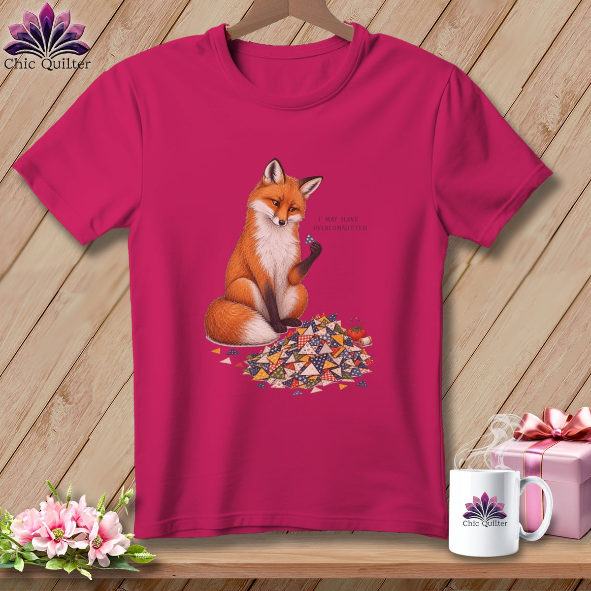 Fox sitting on quilt scraps with text "I MAY HAVE OVERCOMMITTED."