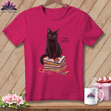 Black cat sitting on quilt squares with text 