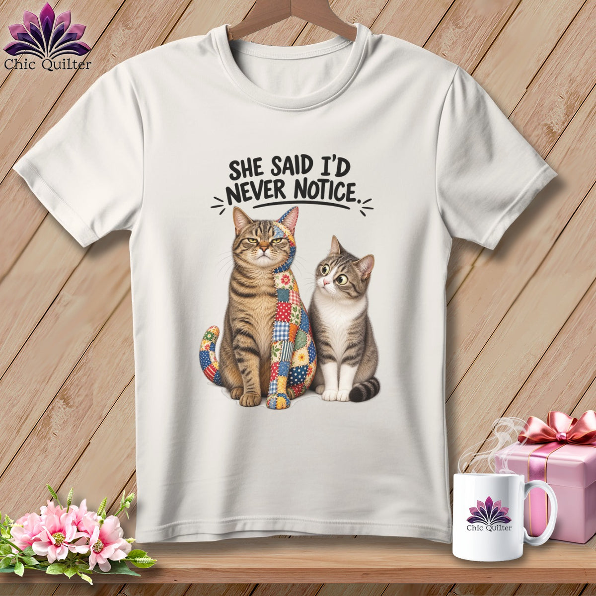 Two cats, one patchwork, sit below text reading "SHE SAID I'D NEVER NOTICE."