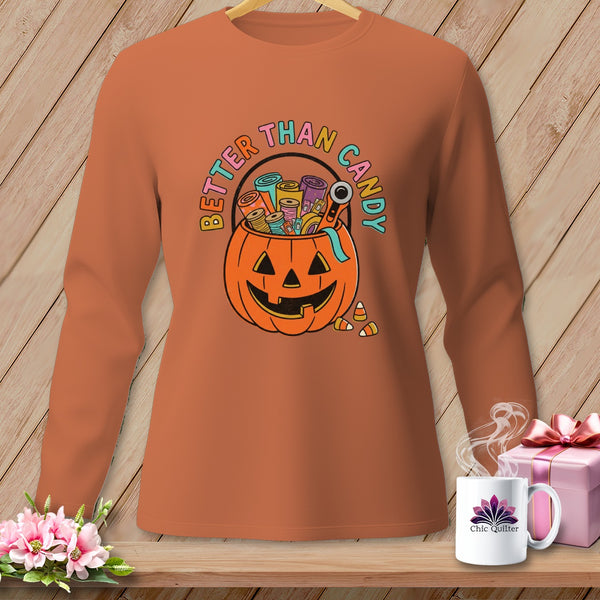 Orange long-sleeve shirt with pumpkin graphic and "Better Than Candy" text.