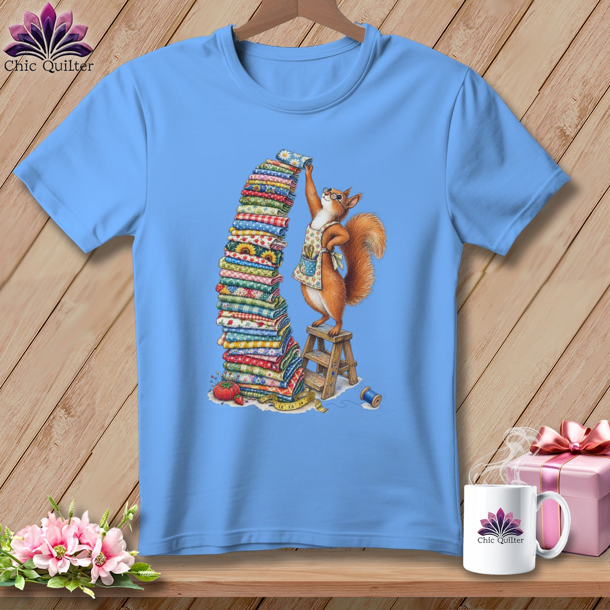 Light blue t-shirt with a squirrel stacking fabric, surrounded by sewing items.