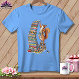 Light blue t-shirt with a squirrel stacking fabric, surrounded by sewing items.