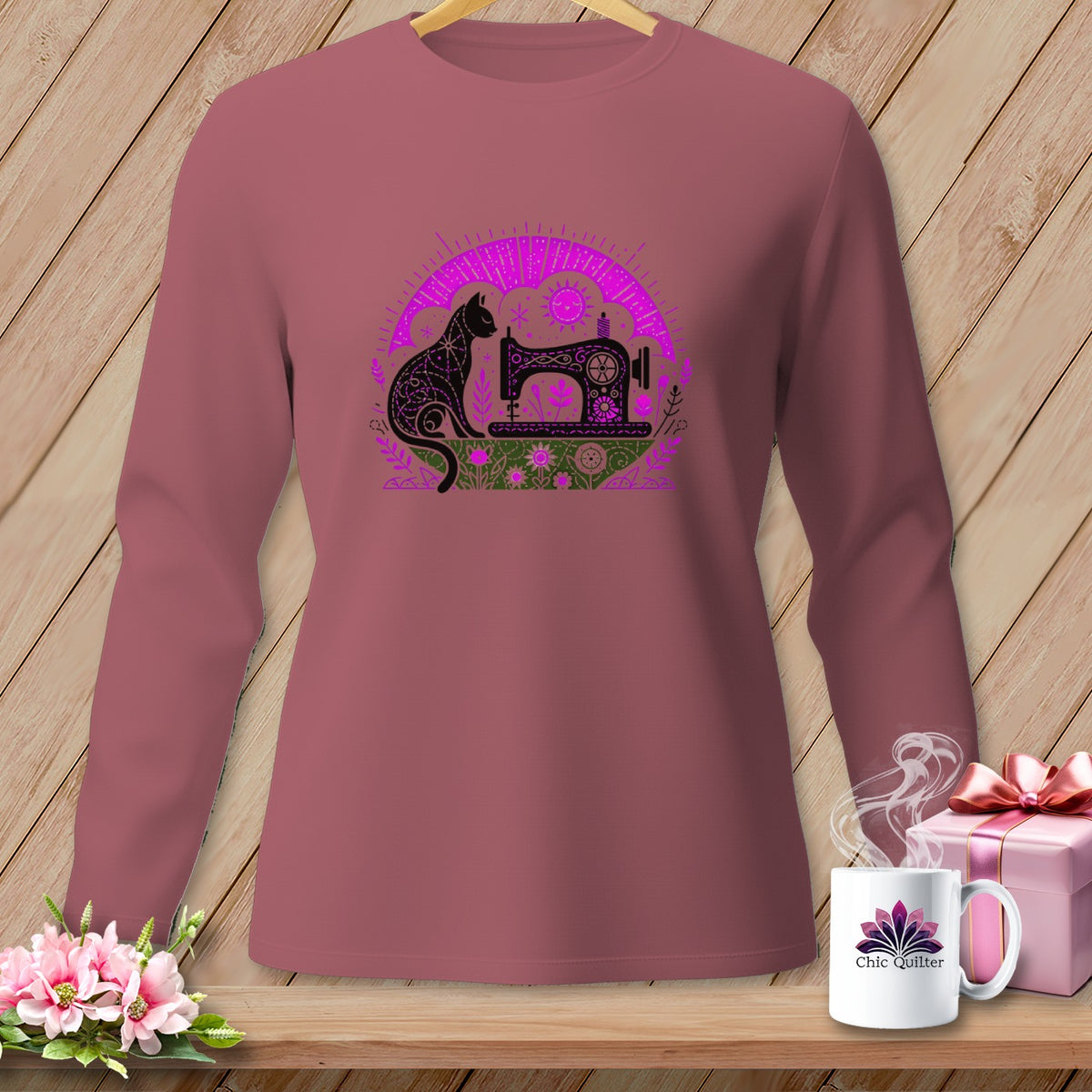 Long-sleeve shirt with a black cat and sewing machine design.