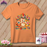 An orange t-shirt displays a graphic of three chickens wearing glasses and floral crowns while holding quilted blocks.