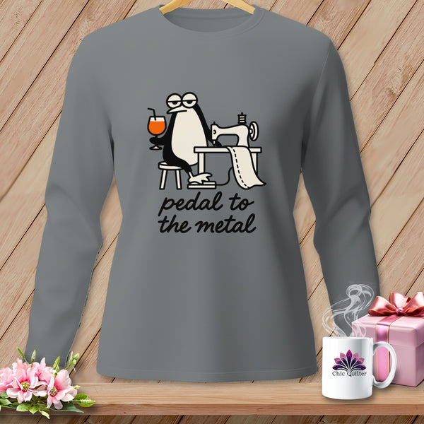 Long sleeve grey shirt with a penguin sewing and text "pedal to the metal".