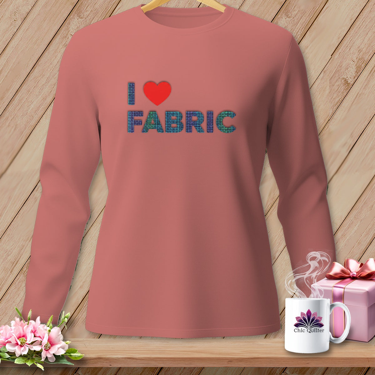Salmon long-sleeve shirt with "I ❤️ FABRIC" graphic and Chic Quilter mug.