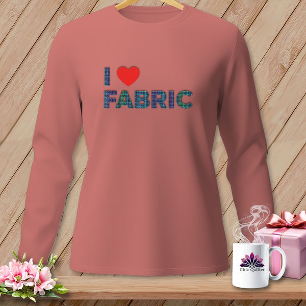 Salmon long-sleeve shirt with "I ❤️ FABRIC" graphic and Chic Quilter mug.