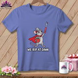 Periwinkle t-shirt featuring a mouse wearing a thimble hat and cape, holding a seam ripper, with the text We Rip At Dawn.