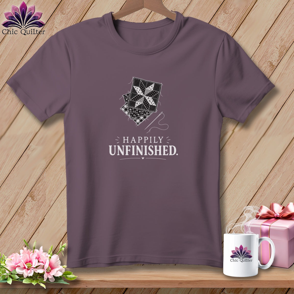 Purple t-shirt with patchwork quilt squares and "Happily Unfinished" text.