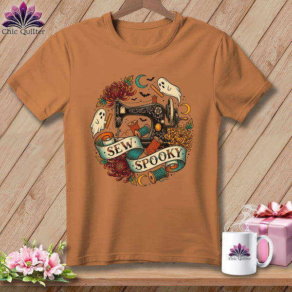 Brown t-shirt with "Sew Spooky" text, sewing machine, ghosts, and flowers design.