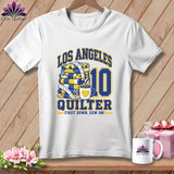 White t-shirt featuring a Los Angeles Quilter graphic with a stack of quilts, coffee mug, and number 10.