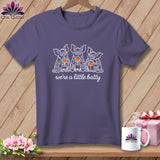 Purple t-shirt with three bats holding wine glasses and the text 