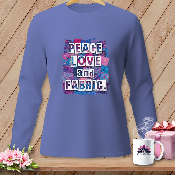 Long-sleeved shirt with "Peace Love and Fabric!" text on a patchwork background.