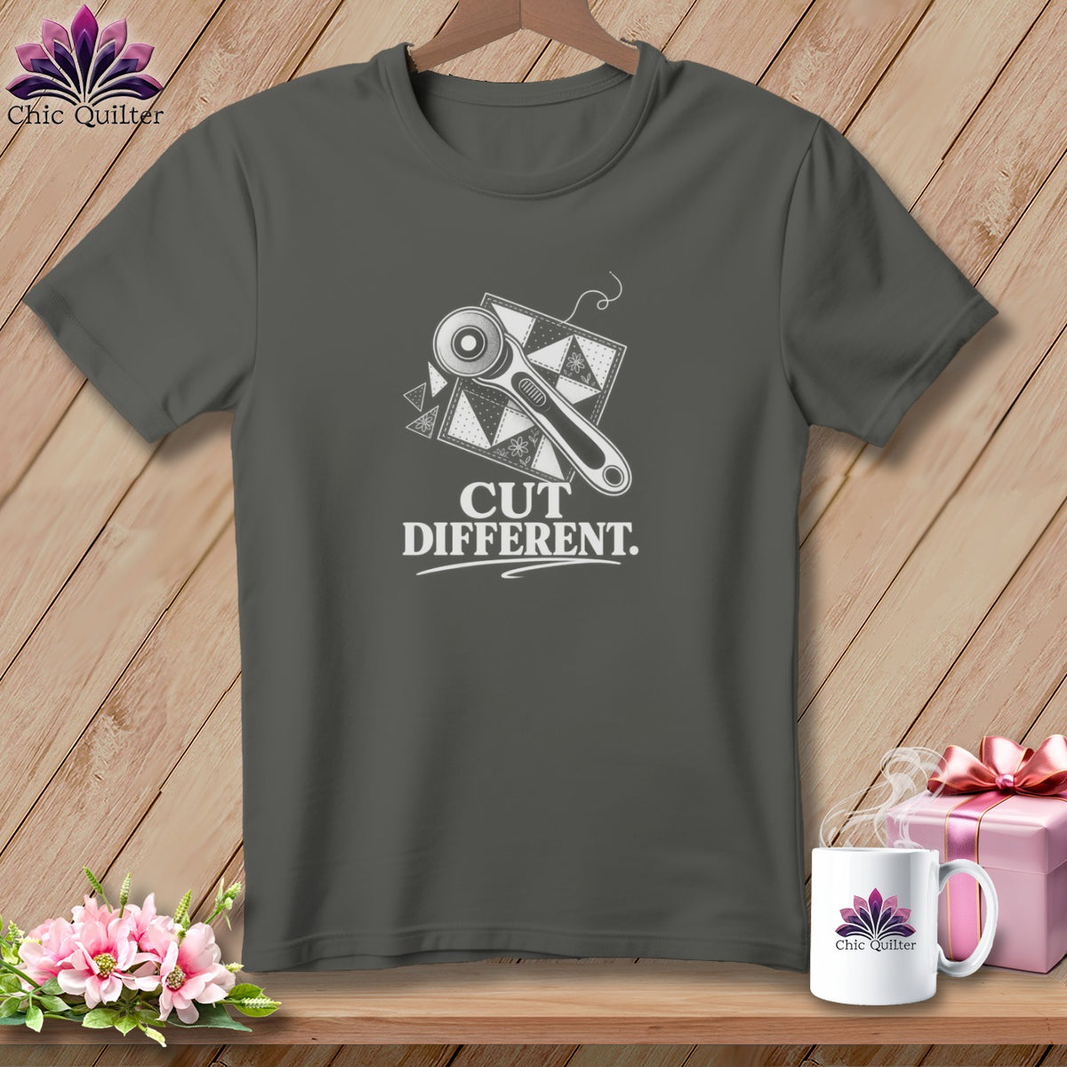 Gray t-shirt with a rotary cutter and patchwork design, reads "CUT DIFFERENT."