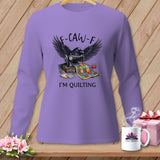 Purple long-sleeve shirt with a raven, sewing machine, and quilt graphic that says 