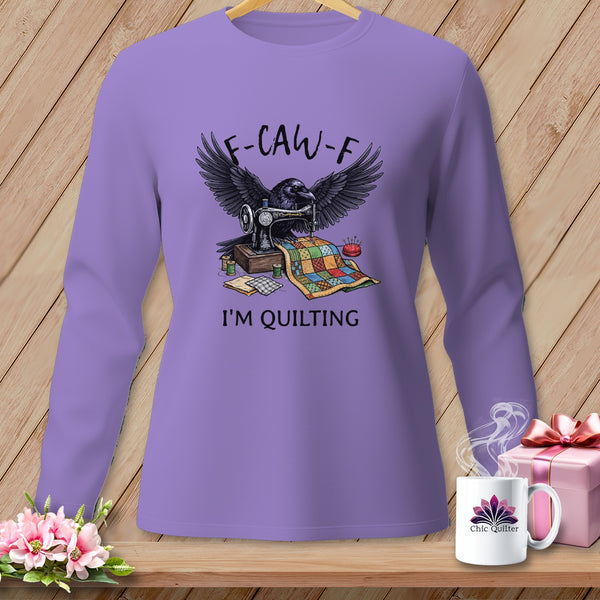 Purple long-sleeve shirt with a raven, sewing machine, and quilt graphic that says "F-CAW-F I'M QUILTING".