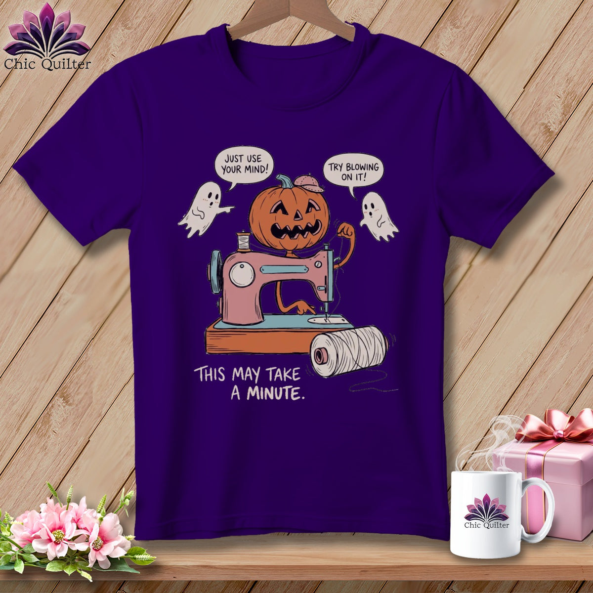 Purple t-shirt with jack-o-lantern and ghosts sewing, text "This May Take A Minute."